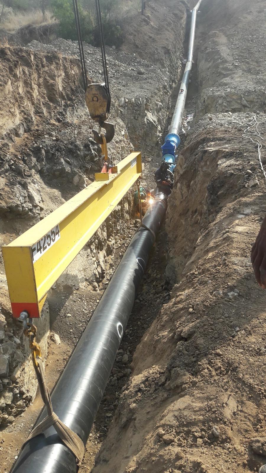 Long large-diameter pipeline being installed in a deep trench